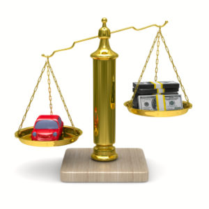 A balance scale demonstrating savings on auto insurance.