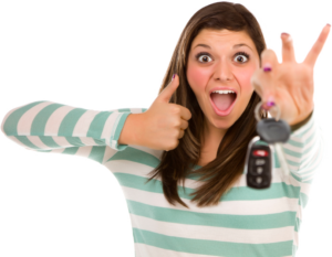 A woman giving a thumbs up while holding a car key, representing comprehensive auto coverage.